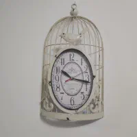 ساعت دیواری طرح قفس پرنده