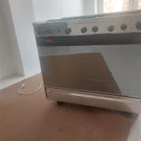 اجاق گاز استیل دارای فر وجوجه گردان