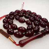 تسبیح کهربا پودری آتشی ۳۳ عددی گندمی تراش کد ۲۹۰
