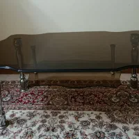 میز وسط شیشهای پایه استیل، همراه میز پذیرایی