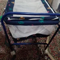 گهواره بچه چهار چرخ