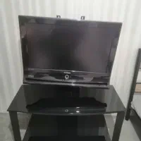 تلویزیون 32 ایکس ویژن با میز تلویزیون