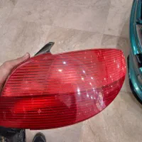 چراغ استوک آکسو عقب راست اورجینال با جا زغالی آکسو