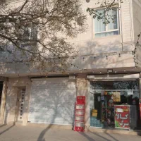 ملک تجاری مسکونی برخیابان بهزاد نبش چهارراه