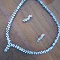 نیم ست گردنبند و گوشواره تیتانیوم در حد نو