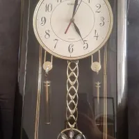 ساعت دیواری آونگ دار