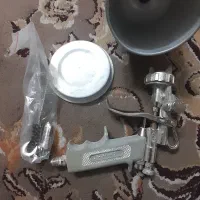 پیستوله و وسایل نقاشی ساختمان