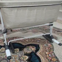 تخت نوزاد کنار مادر