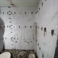 کاشی کاری سنگ کاری  گچ کاری دیوار چینی تخریب بنایی