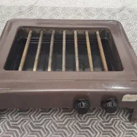 کباب پز هفت شعله گازی دارای سینی با بدنه تمام لعاب