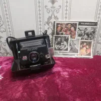 دوربین قدیمی چاپ فوری پولاروید با دفترچه