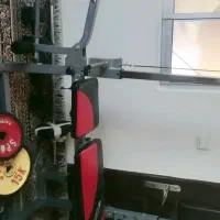 دستگاه چندکاره همراه با صدکیلووزنه