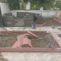 سیمان کاری بنای جدول زدن دورباغچه