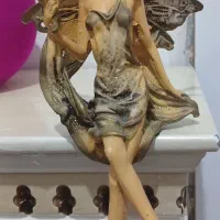 مجسمه فرشته بالدار با مجسمه دختر وپسر