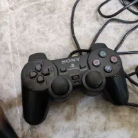 دسته ی پلی استیشن و دستگاه سی دی خور