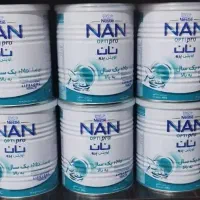 تعدادی قوطی شیر خشک