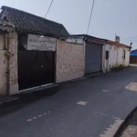 ویلایی با مغازه در حیاط پلاک دو خیابان اصلی