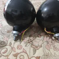 یک جفت چراغ جلو نیسان و یک جفت کفش کار نو