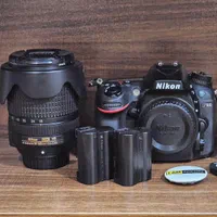 دوربین نیکون D7100 با لنز 140-18 و سه پایه ولبون