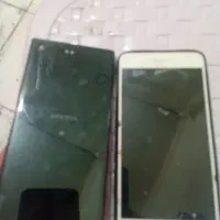 دوعدد گوشی شکسته ونیازبه تعمیرHUAWEI وXPERIA