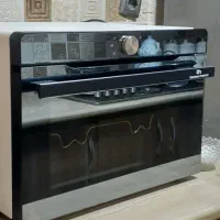 ماکروفر لمسی نو کاملا تمیز و سالم یکبار استفاده شد