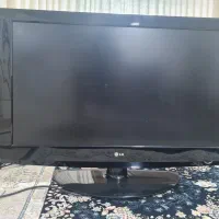 تلویزیون به همراه میز