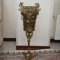 ساعت و سطل آشغال و دستمال کاغذی برنز