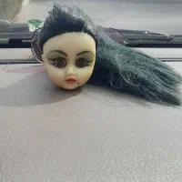 عروسک جلوی اینه