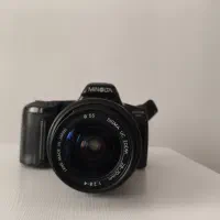 دوربین عکاسی مینولتا همراه لنز حرفه ای