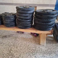 فروش دمبل و صفحه و هالتر قهرمانی بدنسازی