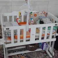 لوازم نوزادتخت گهواره ای چوبی گهواره میلاد