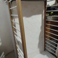 تخت نوزاد همراه با دوشک