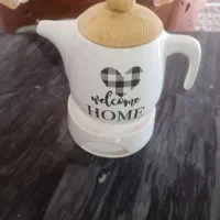 نعلبکی یاخرماخوری وقوری پایمرزیرش شمع میخوره
