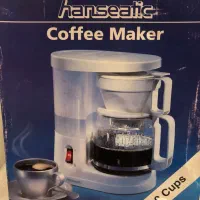 یک دستگاه ابمیوه گیری و قهوه ساز