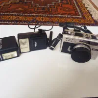 دوربین عکاسی Ricoh و فلش ناسیونال