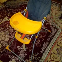 میز ناهار خوری کودک همراه ظرف غذا نو و قصری