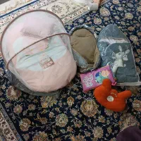 پشه بند آغوشی و قنداق فرنگی نوزاد