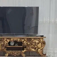 زیر تلویزیون طلایی مدل جدید