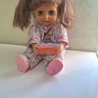 عروسک باطری خور عکاس