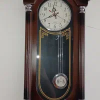 ساعت دیواری طرح چوب پاندول دار