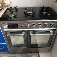 اجاق گاز بدنه تمام استیل و روی کار شیشه اورجینال