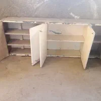 کابینت فلزی و موتور ماشین لباس شویی