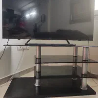 میز تلویزیون شیشه‌ای