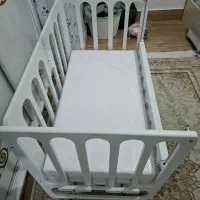 گهواره کنار تخت مادر