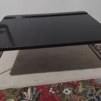 میز تحریر نشسته تاشو