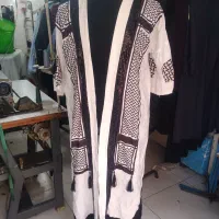 پالتو وبارانی|لباس|قدس, شهرقدس|دیوار