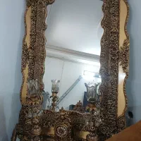 اینه شمعدان و ساعت ایستاده