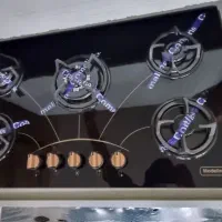 شیشهءای اجاق گاز ءسفید و مشکی