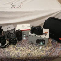 دوربین عکاسی و لنز و کلیه تجهیزات( خواندن توضیحات)