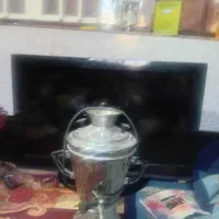 یک عدد تلویزیون و یک عدد سوامبر برنجی قدیمی